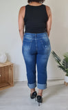 Stretch denim jeans with crossover closure